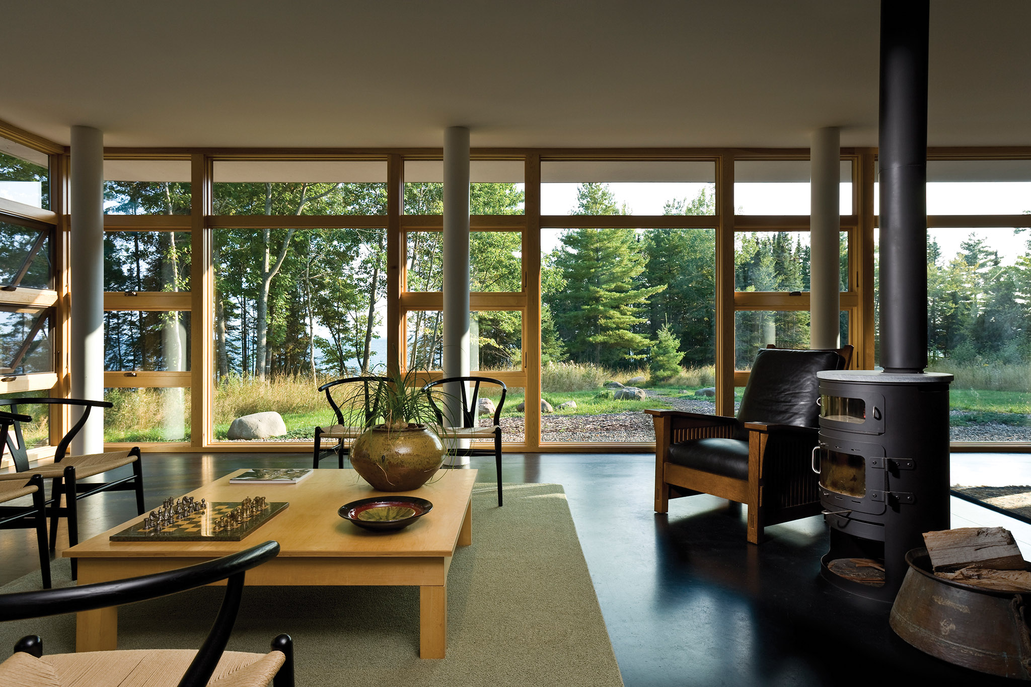 Sun room with fire place and wooden window frames