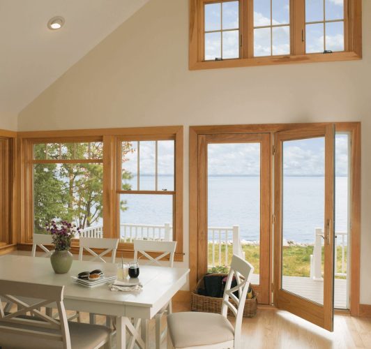 beige dining room with open patio door