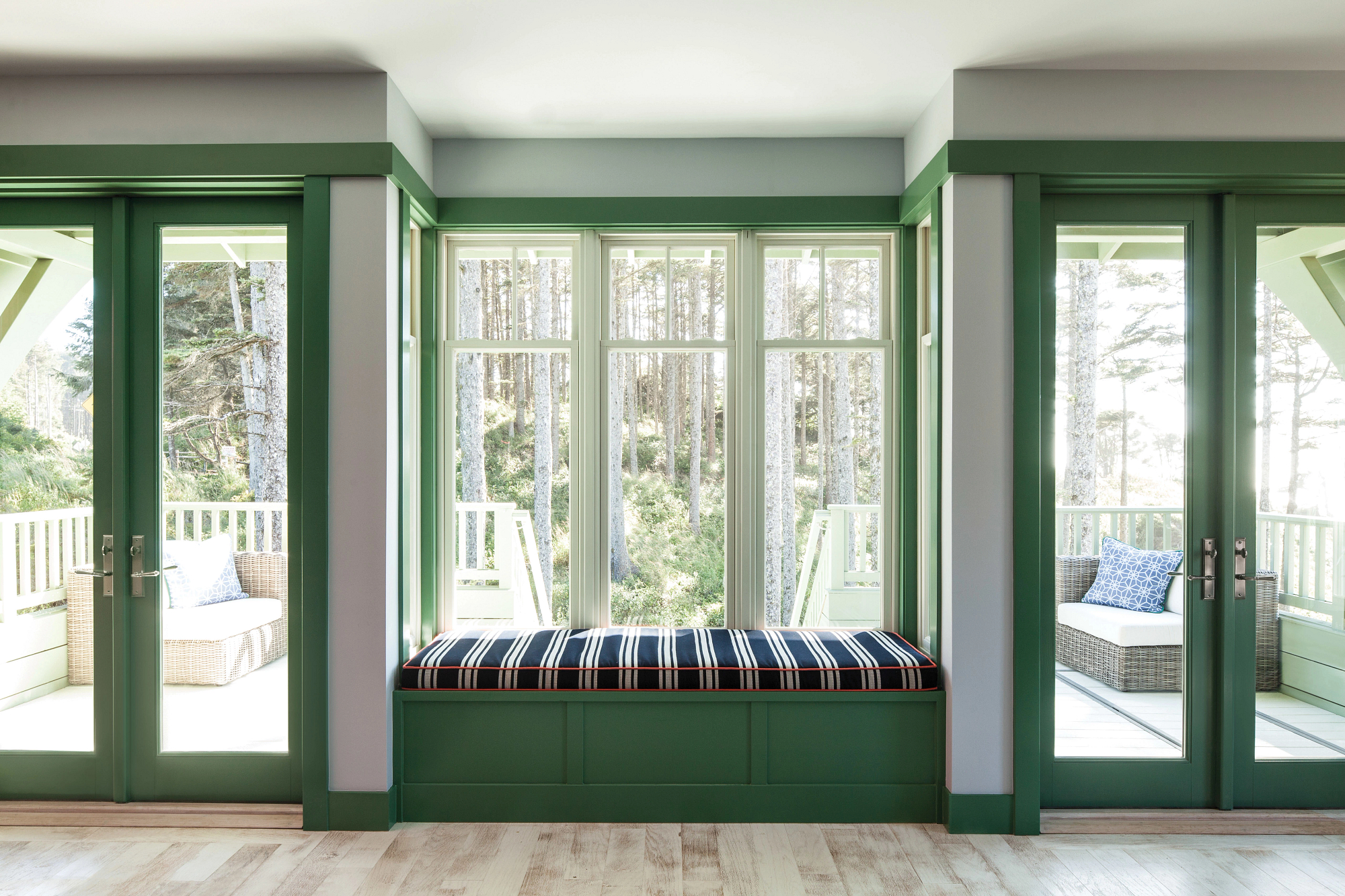 green door and windows set with reading nook