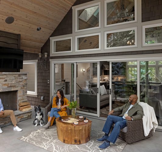 family sitting on patio furniture