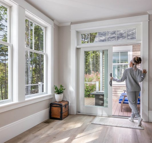 woman opening sliding patio door
